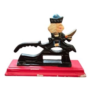 Vintage Cast Iron Nutcracker Painted Soldier on Red Wooden Base